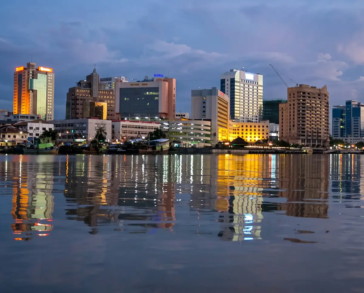 Kuching city skyline at sunset from the Sarawak River